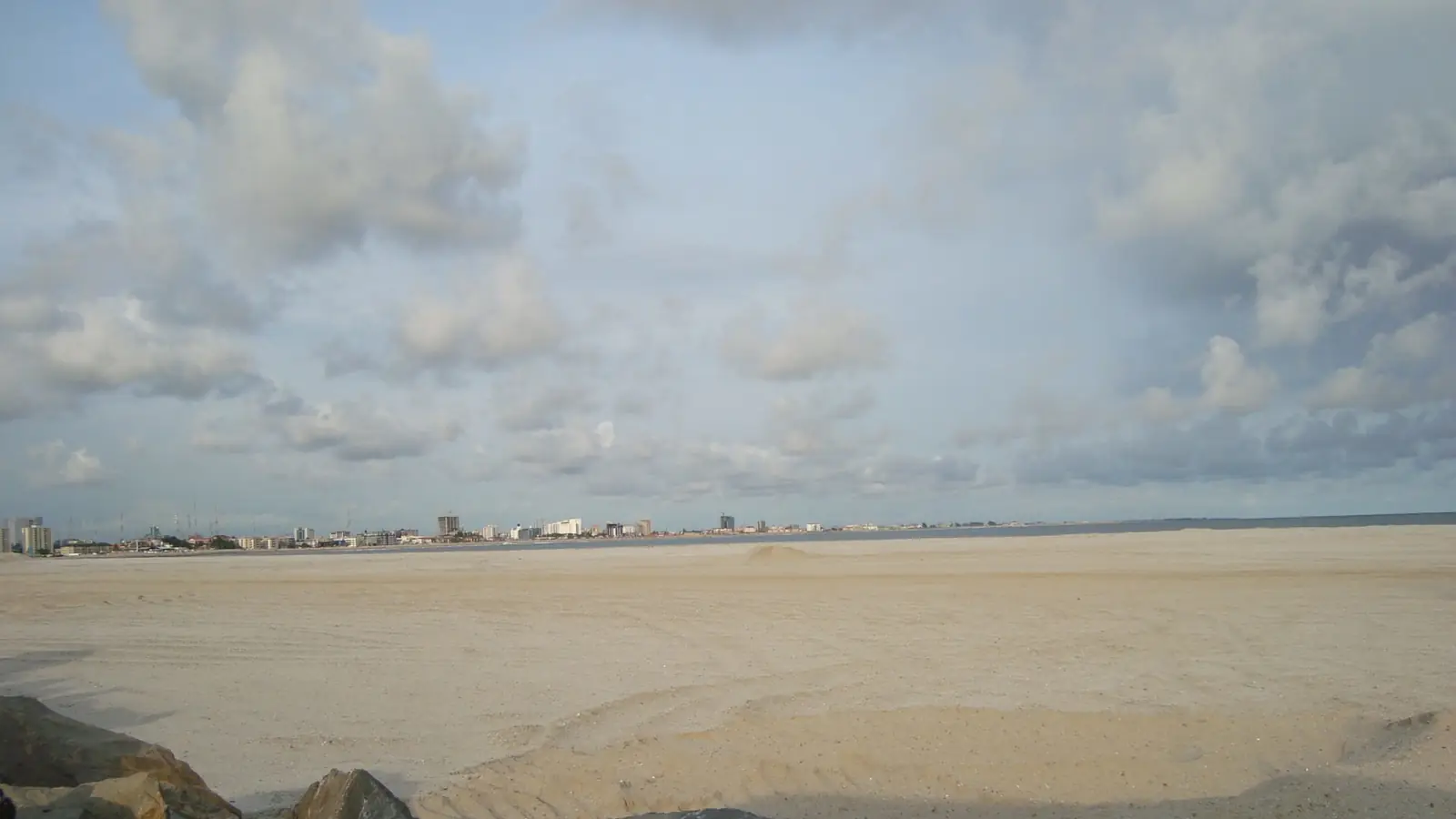 Reclaimed sand at Eko Atlantic in Lagos with the Victoria Island skyline visible across the site